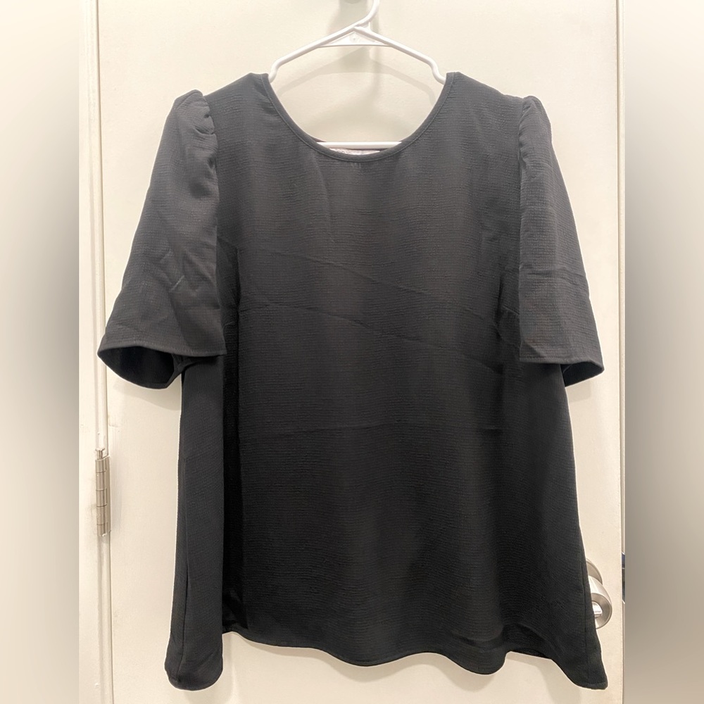 Neverworn, black tulip back blouse. Sz: L